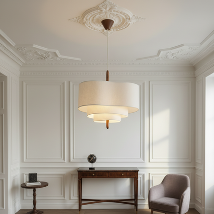 Modern pendant light with beige fabric shade on a white background